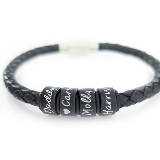 Personalised men’s black braided leather bracelet with engraved black name rings