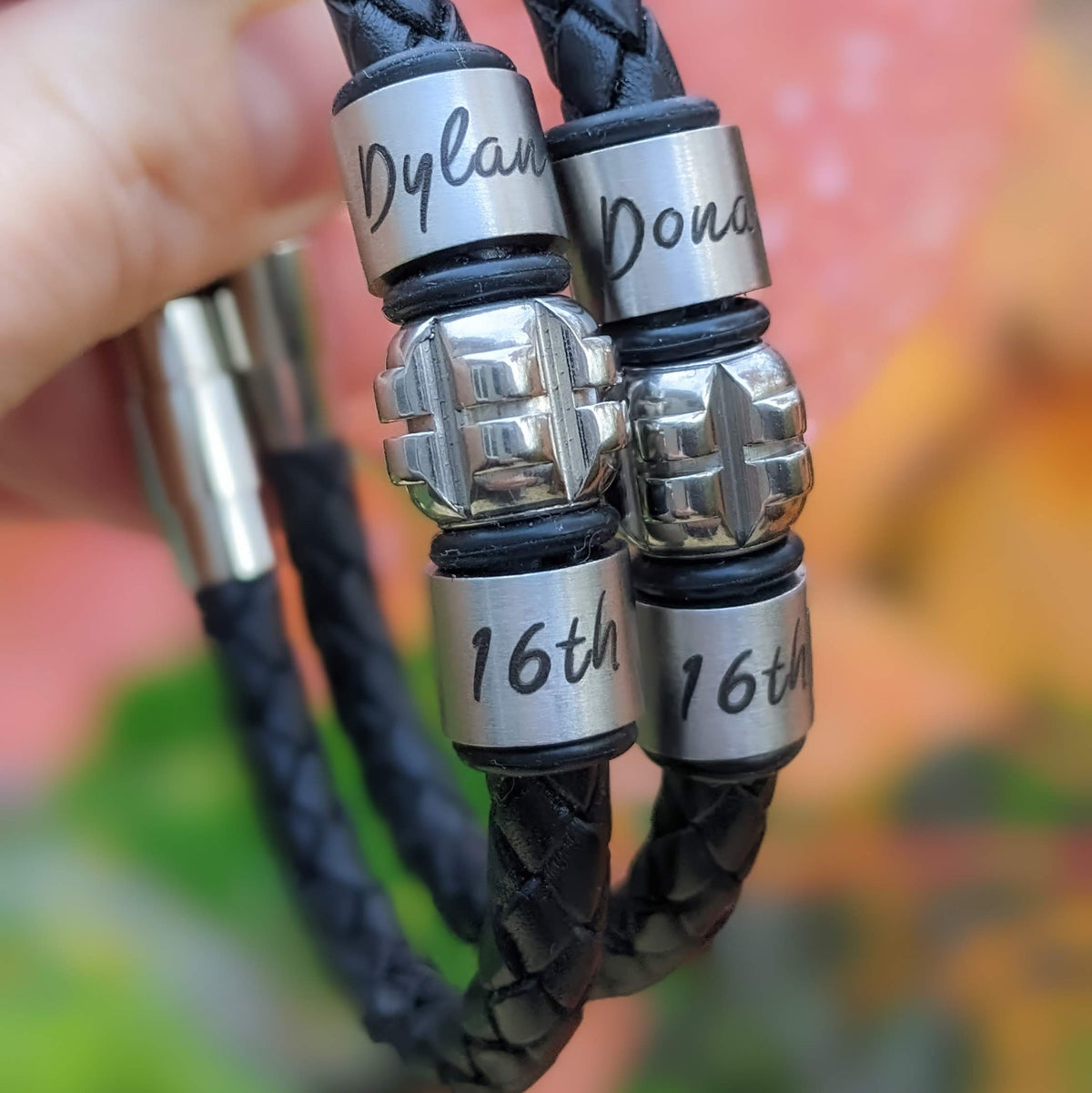 Personalised black leather bracelets with engraved names and 16th birthday rings