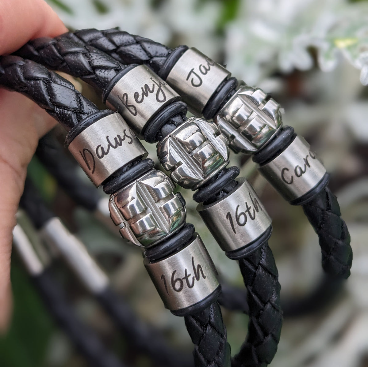 Personalised leather bracelets with engraved names and 16th birthday rings