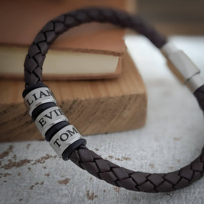 Brown braided leather bracelet with personalised engraved stainless steel name rings