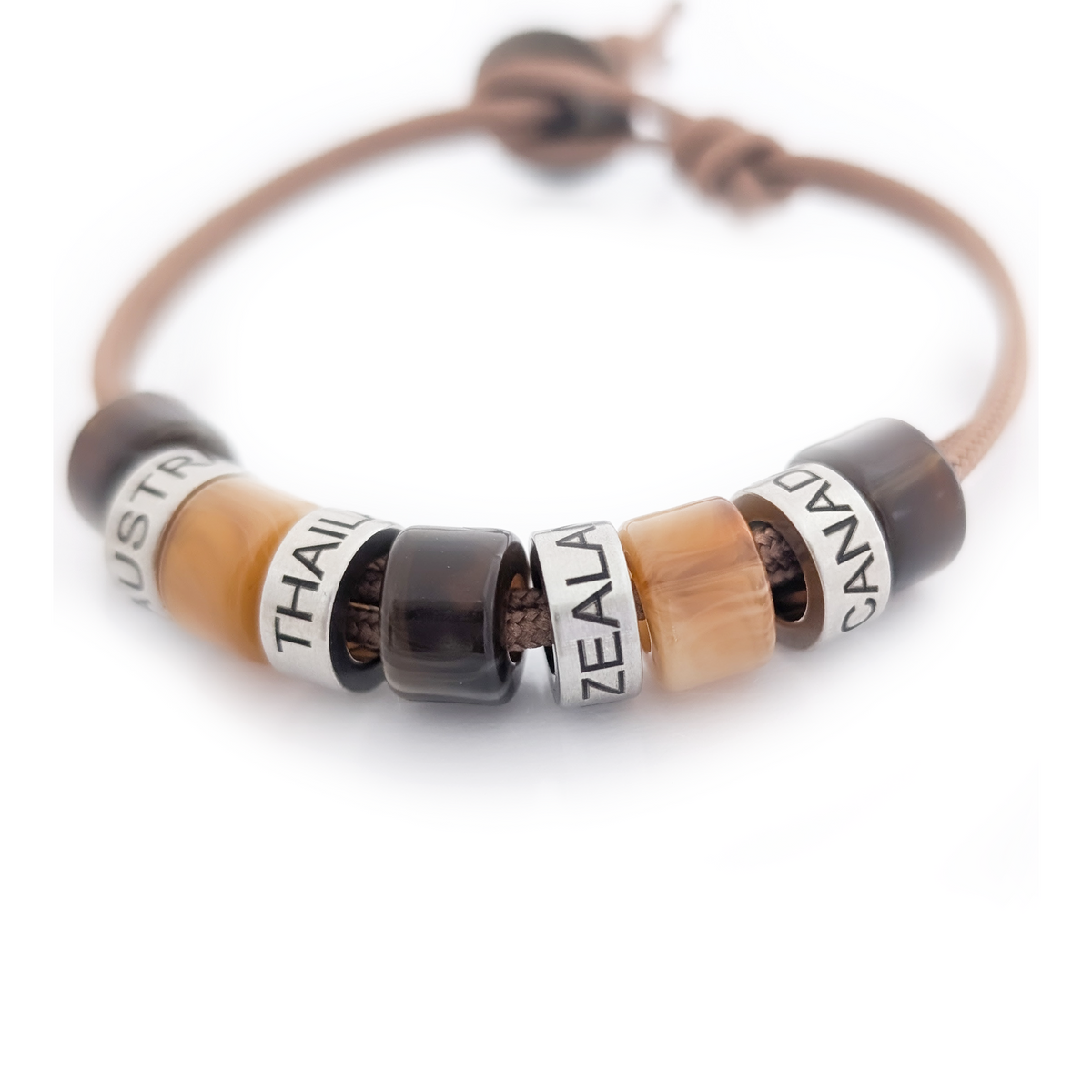 Men’s cord bracelet with custom engraved stainless steel beads