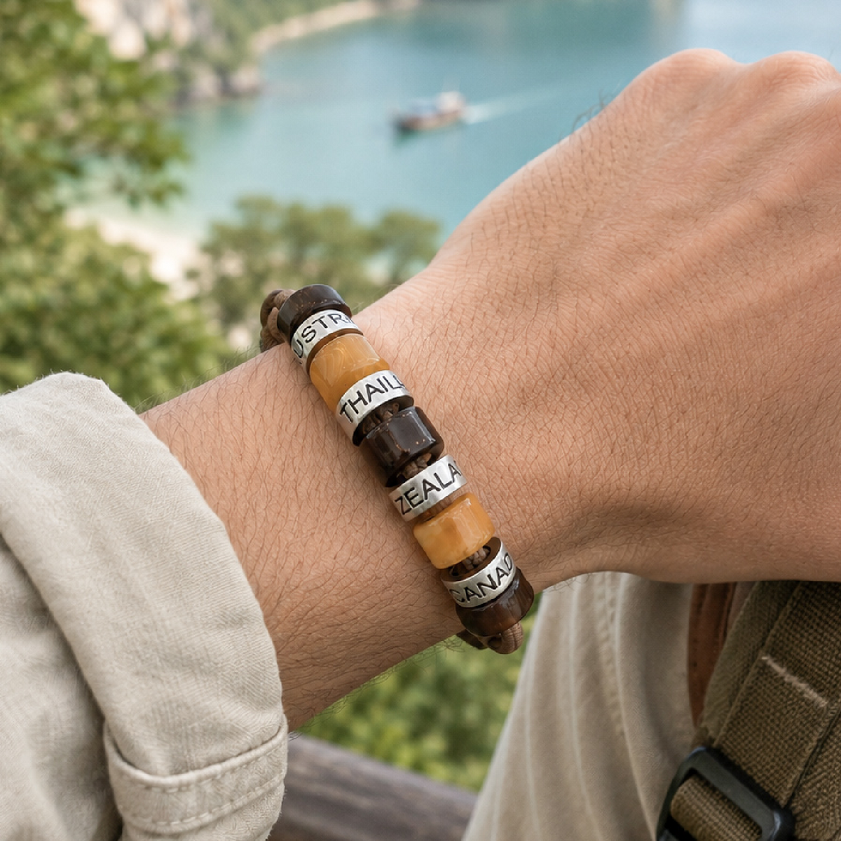Men’s personalised travel bracelet with engraved place-name beads worn outdoors