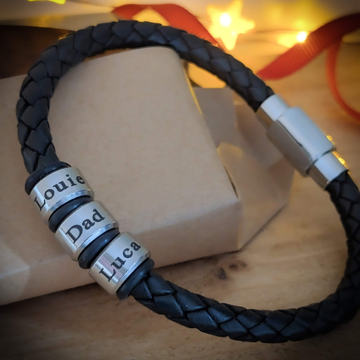 Black men’s braided leather bracelet with engraved stainless steel name rings
